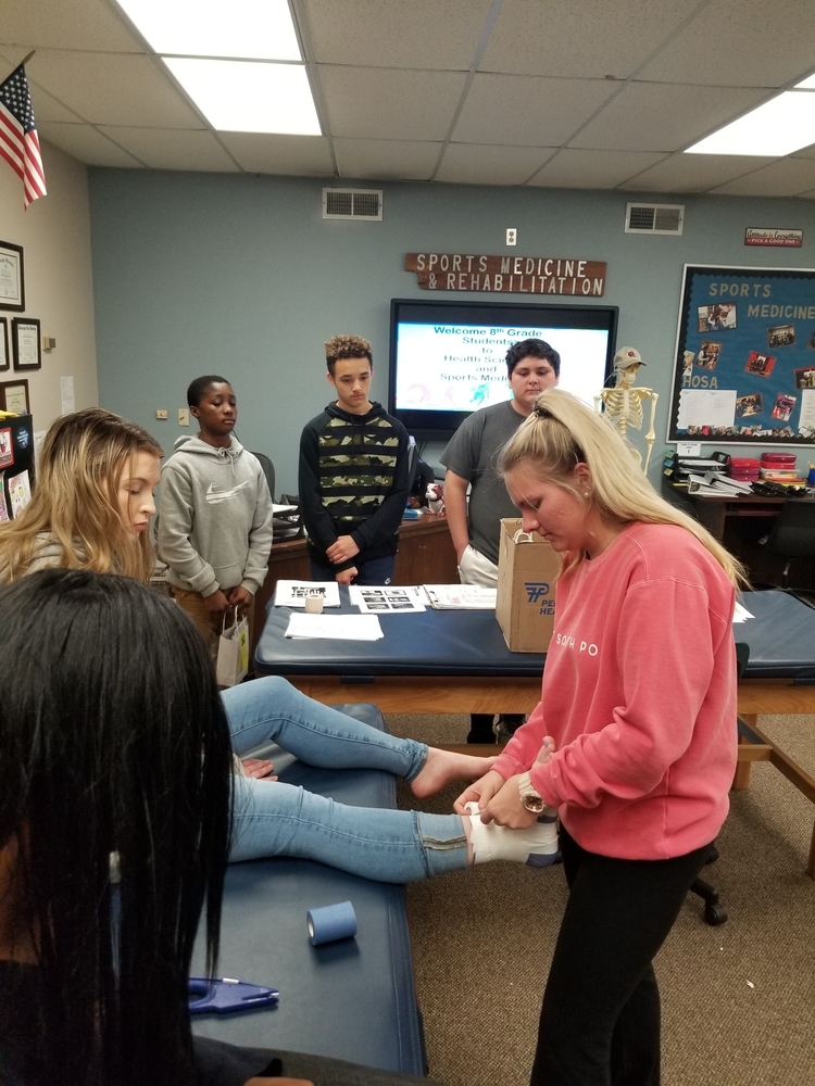 Health Science & Sports Medicine Students provide mock physicals and demonstrations to 8th grade students.