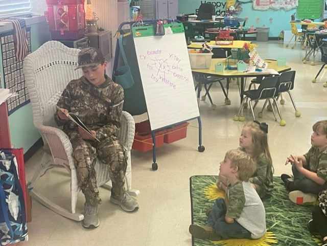 Andrew reading to Pre-k and K.