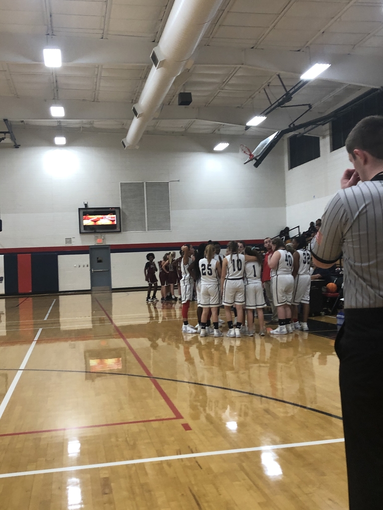 Girls basketball in a huddle 